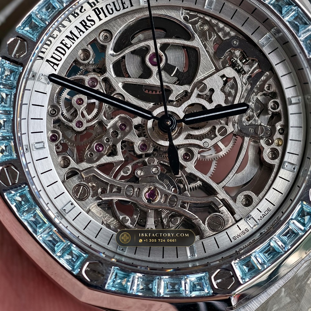 Audemars Piguet Royal Oak Double Balance Wheel Openworked 41mm Baguette Blue Topaz Bezel 18K White Gold Ref. 15412BC.TO.1220BC.01 — XRF Certified Edition — Studio Angle 17 in 18K White Gold Au750 (224.8g Verified Mass, Audemars Piguet Cal. 3132 Dual-Balance Openworked)